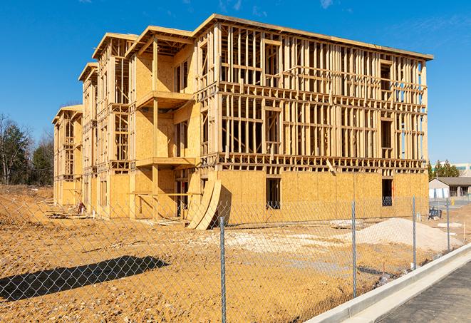 a close-up of temporary chain link fences enclosing a construction site, signaling progress in the project's development in East Ridge TN